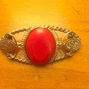 Brooch or scarf pin.